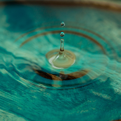 Drops falling in water